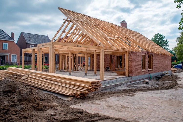 new home constrution with neatly stacked boards
