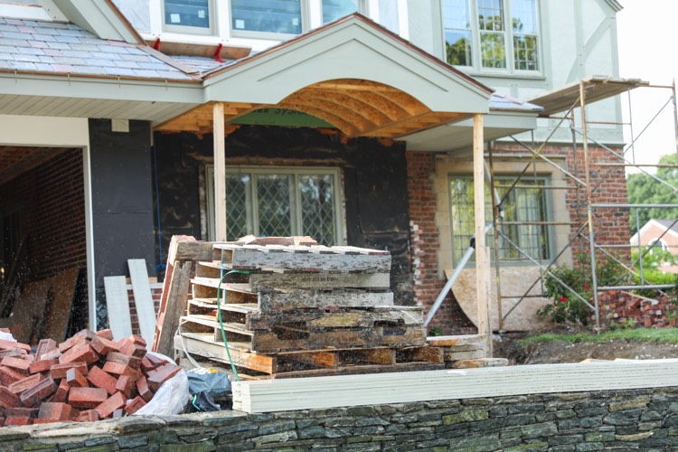 brick house under construction needing cleanup